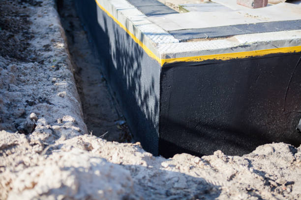 Professional Basement Waterproofing technician working in Charleston, TN